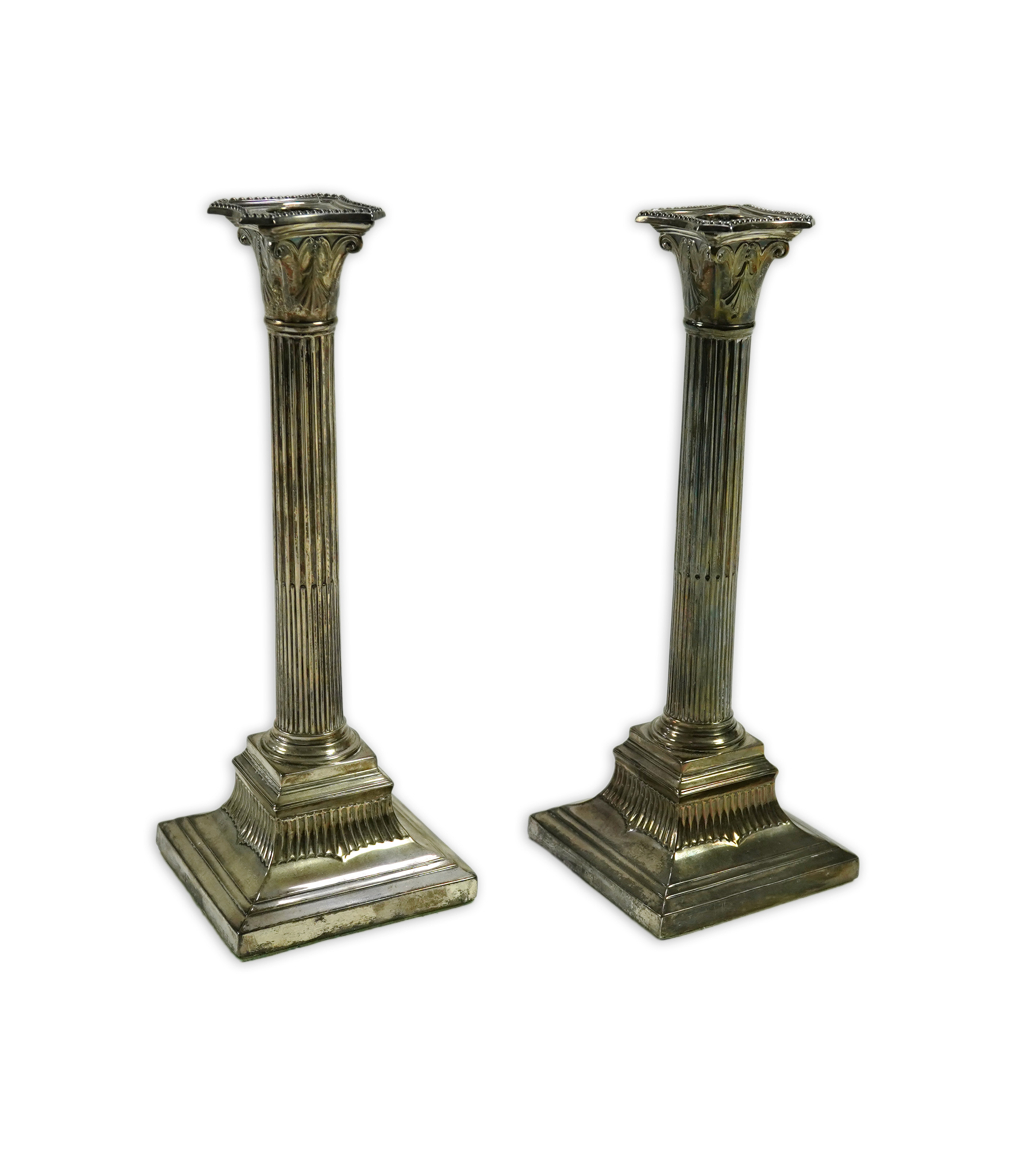 A pair of Victorian silver fluted column candlesticks, by Thomas Bradbury & Sons